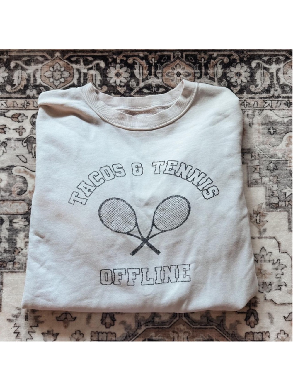 Aerie Offline crewneck sweatshirt with black graphic of two crossed tennis racke